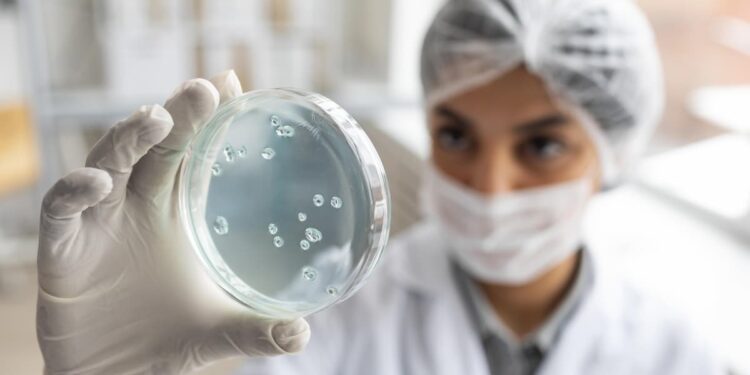 close-up-blurry-scientist-holding-petri-dish
